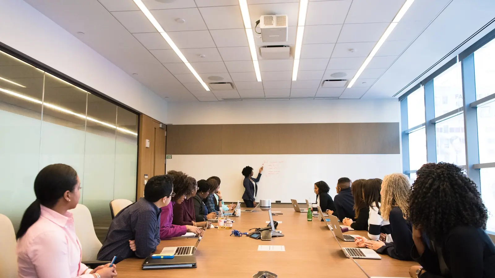A group working together around a boardroom table