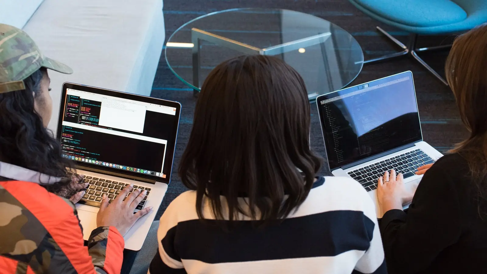 A group working at laptops seen from above