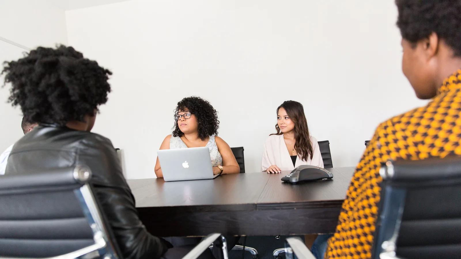 A working meeting in progress around a table