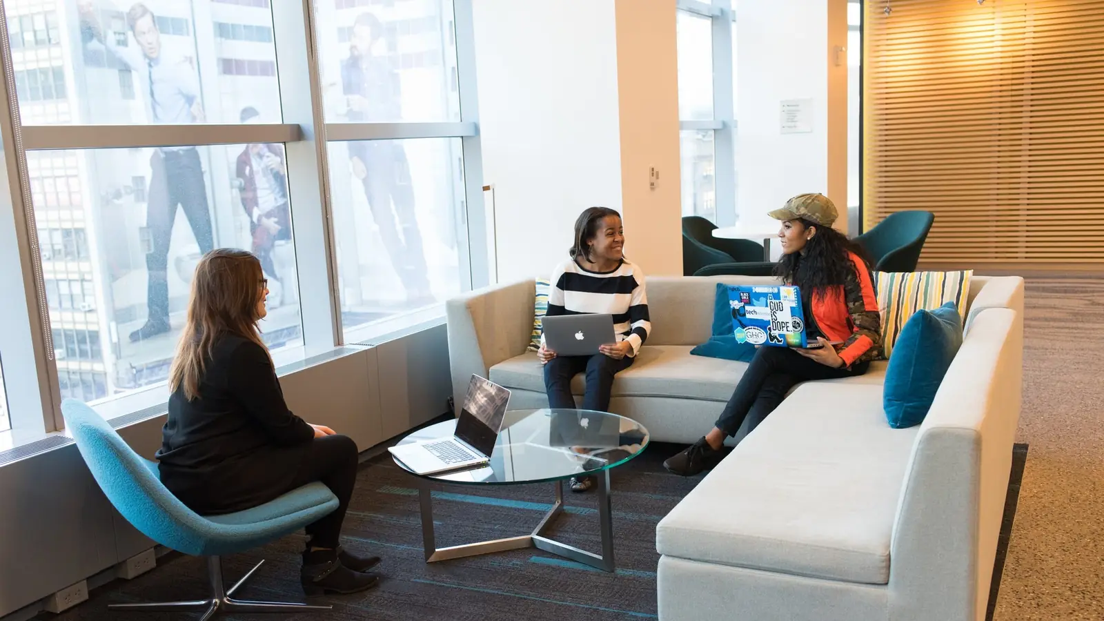 People working in an office lounge