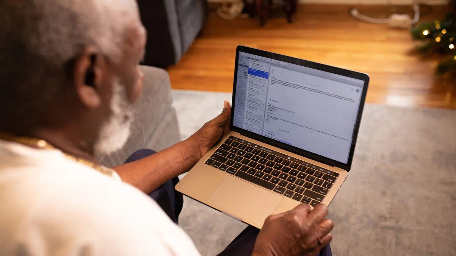 An older professional working at a laptop