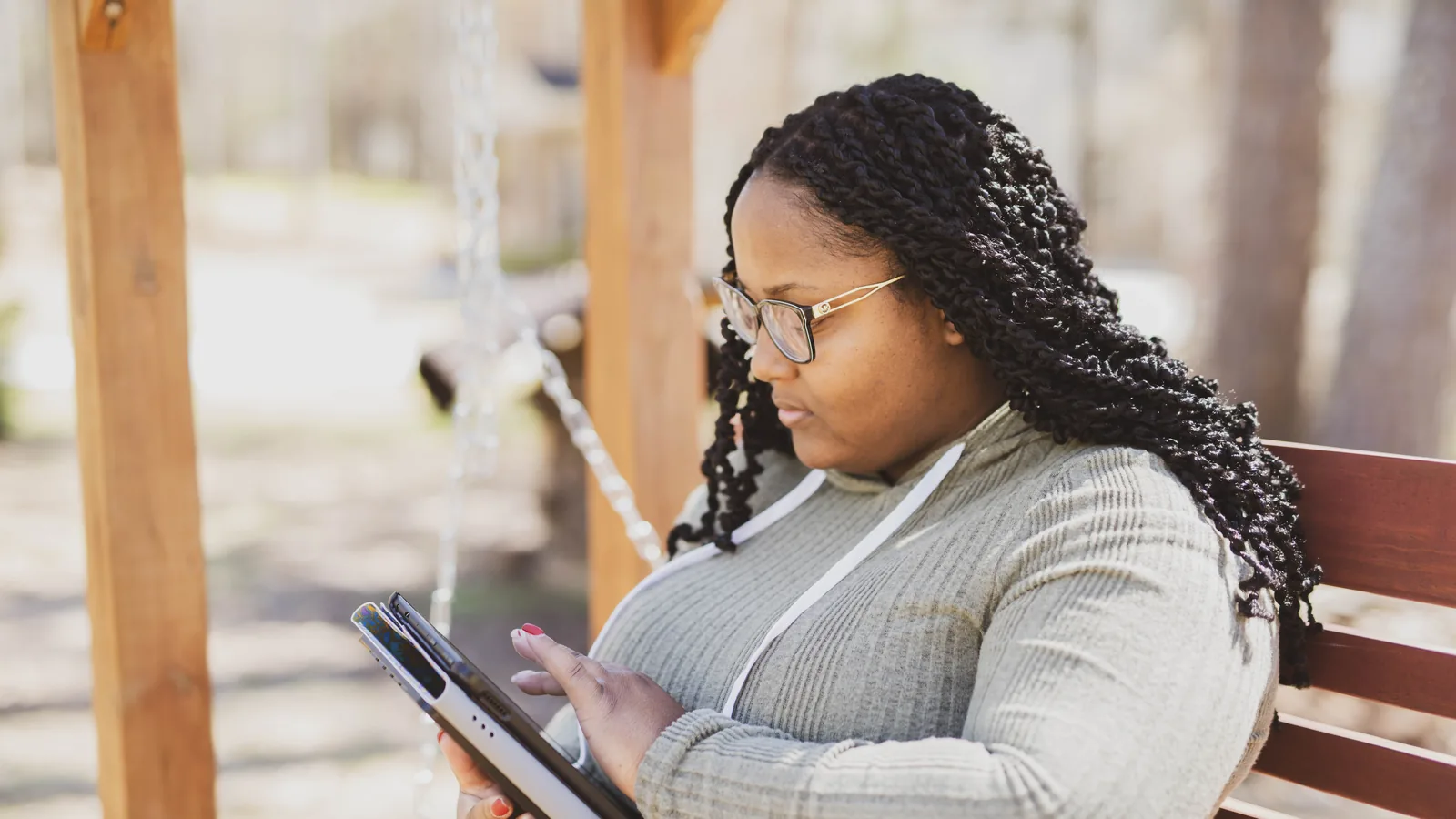 A young professional reading from a tablet