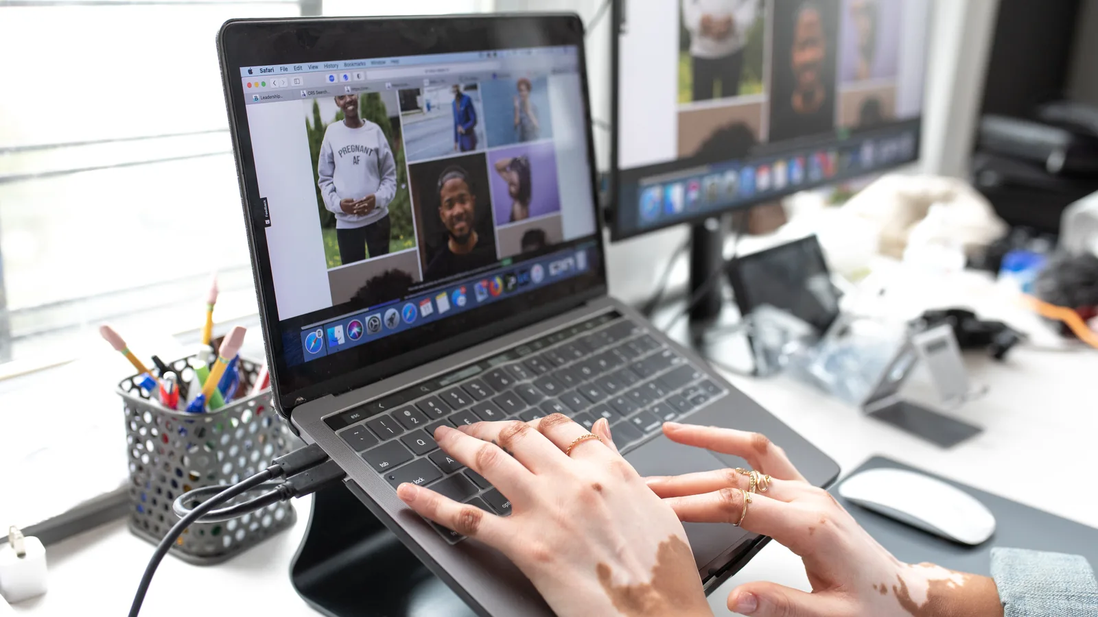 A laptop showing a grid of people on a video call