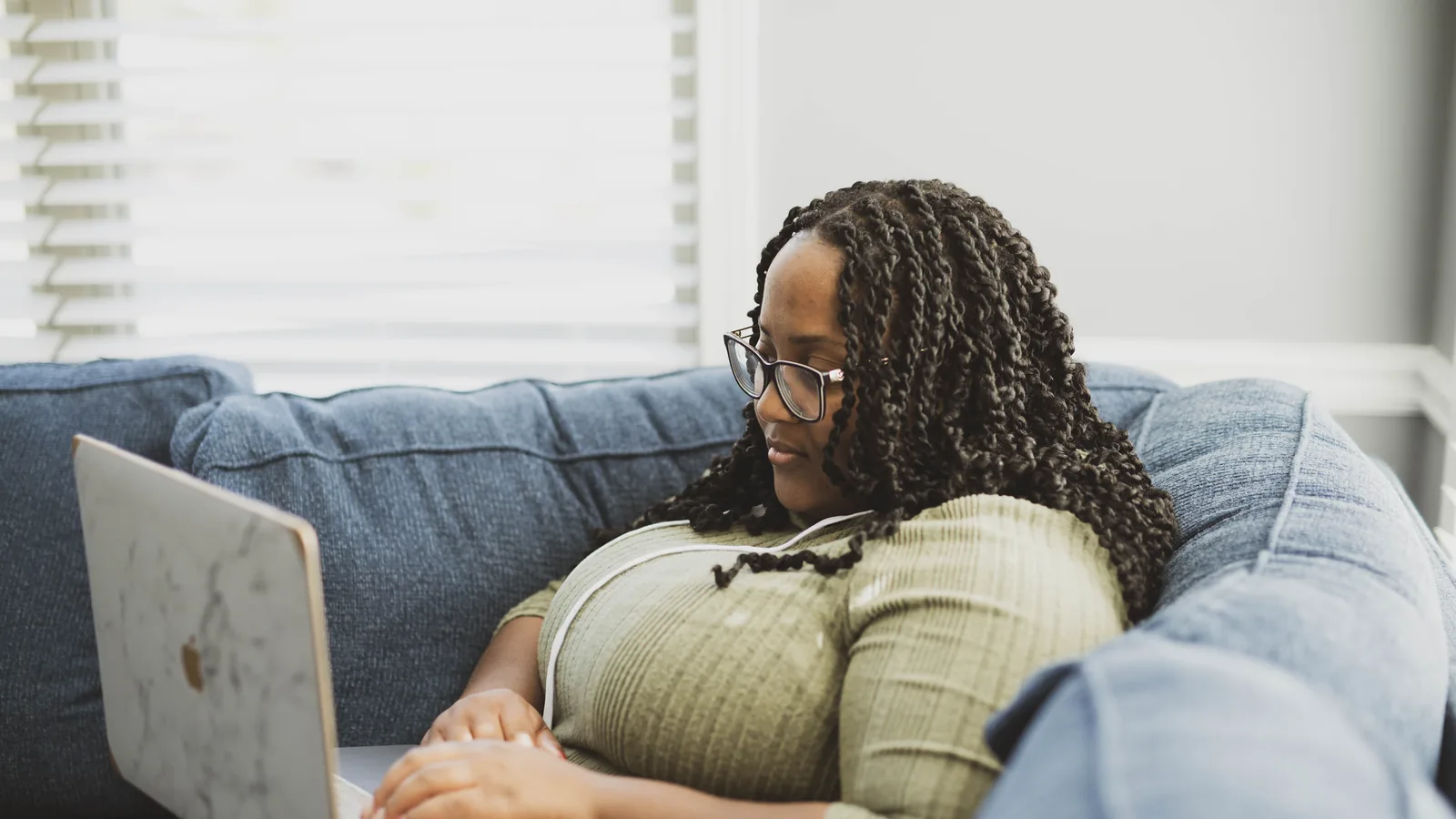 A professional working from home at a laptop